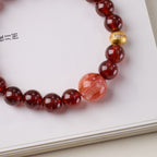 Pulsera de la riqueza con granate rojo vino y cuarzo hematóide