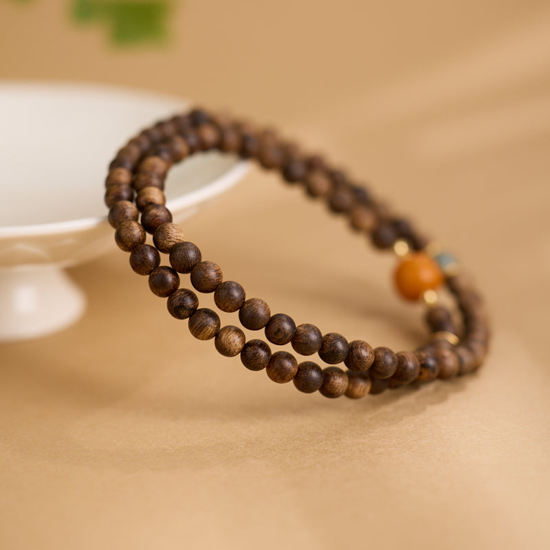 Mala de richesse Zen 108 perles en bois d’agar et ambre