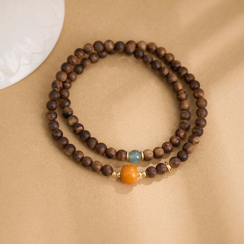 Mala de richesse Zen 108 perles en bois d’agar et ambre