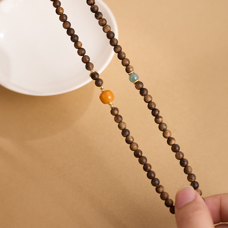 Mala de richesse Zen 108 perles en bois d’agar et ambre